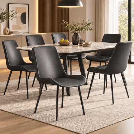 Six dark grey dining chairs around a marble-effect dining table