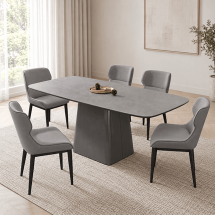 Grey PU leather dining chairs arranged around a modern dining table