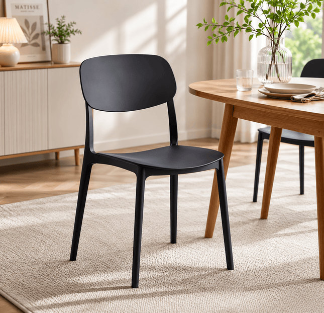 Modern black stackable plastic dining chair