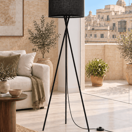 Modern black tripod floor lamp with fabric drum shade and foot switch
