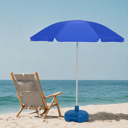 Blue beach umbrella with weighted base on sandy beach