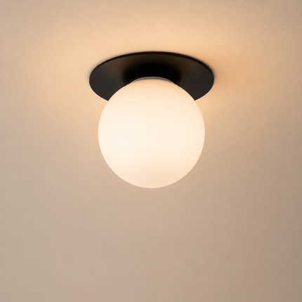 Minimalist black flush mount ceiling light with frosted glass globe shade