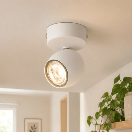 Matt white adjustable ceiling spotlight installed in modern living room