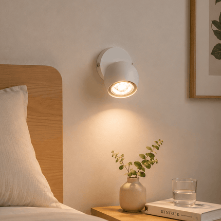 Modern matt white spotlight used as bedside wall light