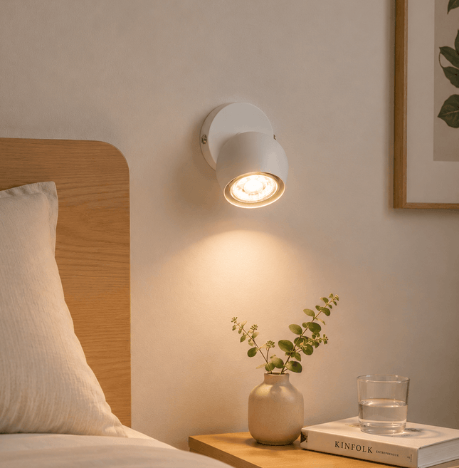 Modern matt white spotlight used as bedside wall light