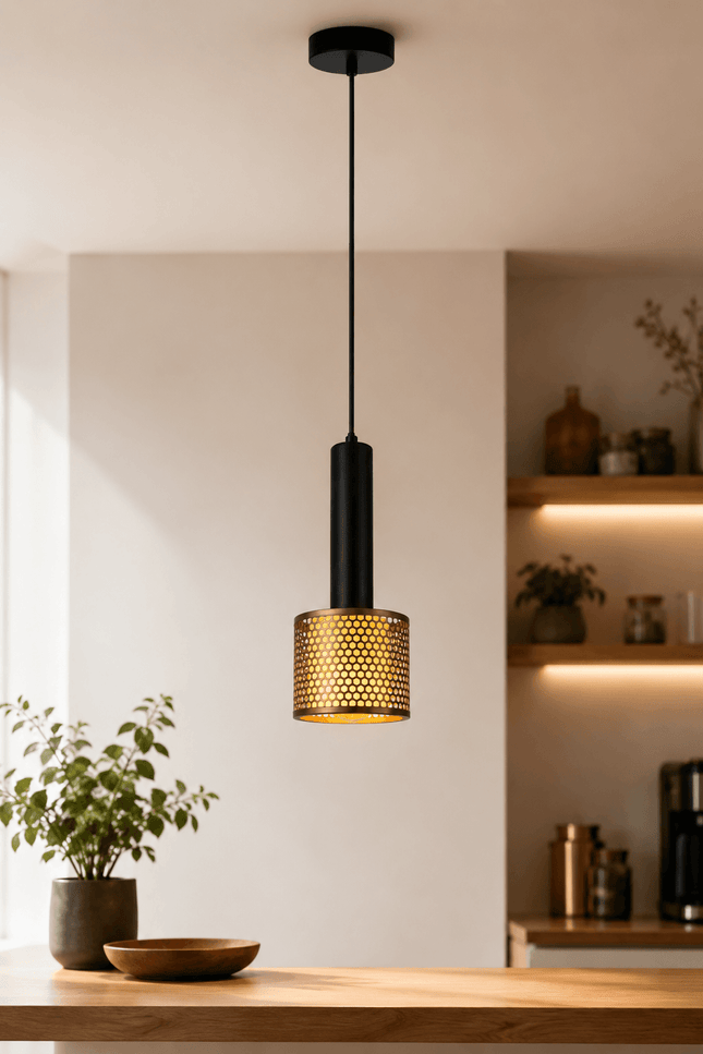 Modern black and gold single pendant light above kitchen island