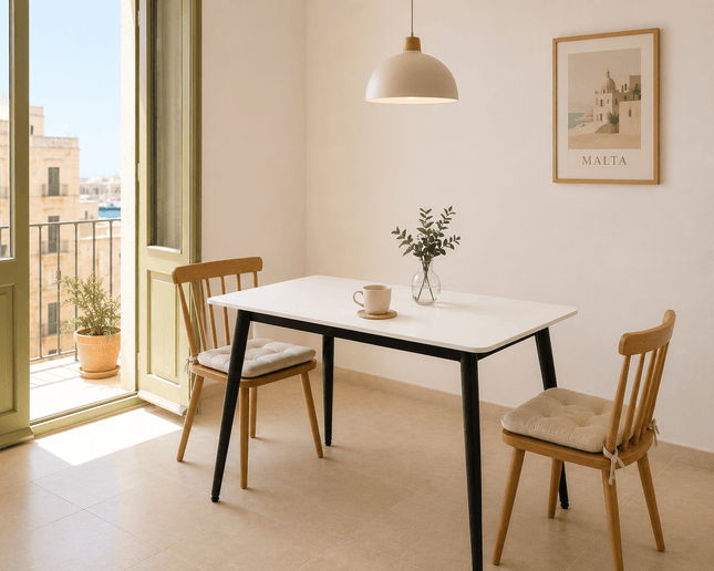 Modern white dining table with black legs in apartment dining room