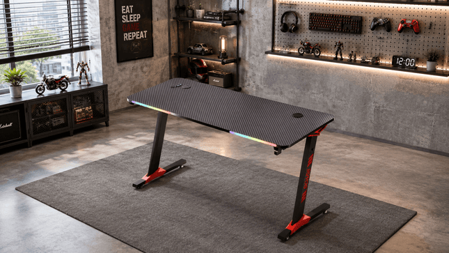 Modern RGB gaming desk setup in industrial style gaming room with LED lights