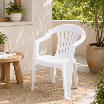 White stackable outdoor plastic arm chair for garden and patio use