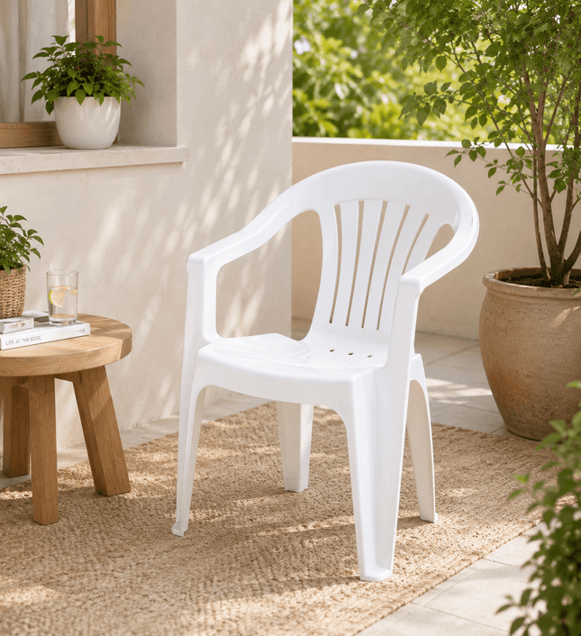 White stackable outdoor plastic arm chair for garden and patio use