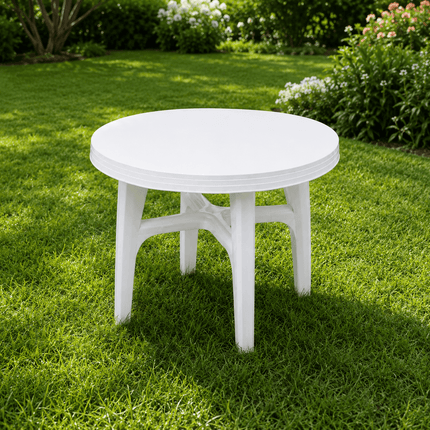 White round outdoor plastic patio table in garden